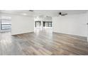 Bright and airy living room with wood-look flooring at 4175 103Rd N Ave, Clearwater, FL 33762