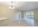 Bright living room with tile floors and sliding glass doors at 2333 Feather Sound Dr # B101, Clearwater, FL 33762