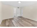 Simple bedroom with vinyl flooring and neutral wall colors at 4220 Sheldon Pl # 4220, New Port Richey, FL 34652