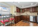 Modern kitchen with granite countertops and wood cabinets at 5200 Brittany S Dr # 1708, St Petersburg, FL 33715