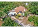 Aerial view of a dome house with surrounding trees at 7923 18Th E Ave, Palmetto, FL 34221