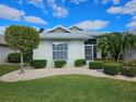 Front view of a house showcasing well-maintained landscaping at 2421 E Del Webb Blvd, Sun City Center, FL 33573
