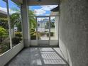 A screened porch with a view of the backyard and surrounding area at 2421 E Del Webb Blvd, Sun City Center, FL 33573
