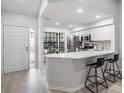 Updated kitchen with white cabinets and quartz countertops at 2582 Bentley Dr, Palm Harbor, FL 34684