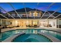 Inviting pool and spa area with covered patio, perfect for outdoor entertaining at 3073 Woodsong Ln, Clearwater, FL 33761