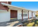 Inviting front entrance with double doors and a covered porch at 7002 Lawnview Ct, Tampa, FL 33615