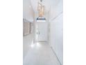 Elegant entryway with a modern chandelier and tile floors at 943 Lucas Ln, Oldsmar, FL 34677