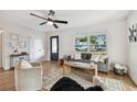 Spacious living room with hardwood floors and plenty of light at 10721 64Th Ave, Seminole, FL 33772