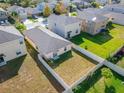 Aerial view of a house and surrounding neighborhood at 17036 Peaceful Valley Dr, Wimauma, FL 33598