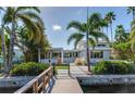 Mid-century modern home with backyard and private dock at 16434 Redington Dr, Redington Beach, FL 33708