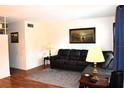 Living room with sectional sofa, end tables, and lamps near window at 2100 World Parkway Blvd # 58, Clearwater, FL 33763