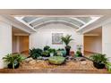 Serene lobby with a water feature and plants at 500 Treasure Island Cswy # 606, Treasure Island, FL 33706