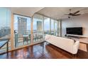 Living room features city views, balcony access, and comfortable seating at 777 N Ashley Dr # 1808, Tampa, FL 33602
