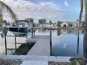 Private dock with boat lift offering waterfront access at 8060 Gulf Blvd, St Pete Beach, FL 33706