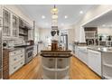 Spacious kitchen with a large island, stainless steel appliances, and custom cabinetry at 2501 Rustic Oaks Dr, Lutz, FL 33559