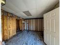 Unfinished interior room with exposed walls and flooring at 329 Country Club Dr, Oldsmar, FL 34677