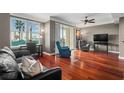 Inviting living room featuring hardwood floors, a ceiling fan, and a sliding glass door to a balcony at 345 Bayshore Blvd # 308, Tampa, FL 33606