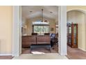 Spacious living room with large windows and comfortable seating at 11004 Carnes St, Weeki Wachee, FL 34613