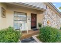 Inviting front porch with seating and stone accents at 12248 Katherwood St, Spring Hill, FL 34608