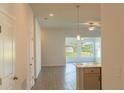 Bright living room with tile flooring and access to backyard at 25434 Colon Dr, Punta Gorda, FL 33983