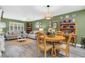 Inviting living room featuring hardwood floors, natural light, and a lovely decor with comfortable furnishings at 2939 Yucca Ct, Palm Harbor, FL 34684