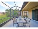Covered patio area offering a relaxing space for outdoor dining and entertainment at 5721 Sunset Falls Dr, Apollo Beach, FL 33572