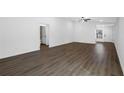Bright living room with dark gray vinyl plank flooring at 29502 Fedora Cir, Brooksville, FL 34602