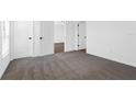 Bright bedroom with plush carpeting and ample closet space at 29604 Fedora Cir, Brooksville, FL 34602
