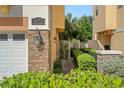 Side view showing address and landscaped walkway at 562 Rivercrest Ln, Tarpon Springs, FL 34689