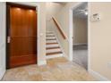 Home interior showing elevator and staircase at 562 Rivercrest Ln, Tarpon Springs, FL 34689