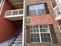 Exterior view of condo building showcasing stairs and building number at 10200 Gandy N Blvd # 921, St Petersburg, FL 33702