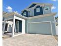 Two-story home with blue and light green siding at 3829 71St N St, St Petersburg, FL 33709
