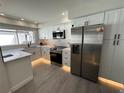 Modern kitchen with white cabinets and quartz countertops at 3963 Glen Oaks Manor Dr, Sarasota, FL 34232