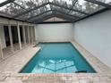 Inviting rectangular pool with a covered patio at 3963 Glen Oaks Manor Dr, Sarasota, FL 34232