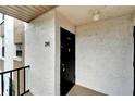 Private entrance to a condo unit with a black door and number 291 at 107 Caldwell Dr # 291, Brandon, FL 33510