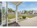 View from the front porch of the home and surrounding neighborhood at 37652 New Horizons Blvd, Zephyrhills, FL 33541