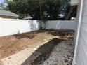 Simple backyard with a small paved patio area at 4201 Dr Martin Luther King Jr N St, St Petersburg, FL 33703