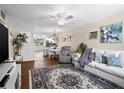 Bright living room with hardwood floors, comfortable furniture, and kitchen views at 4715 Bay Ne St # 223, St Petersburg, FL 33703