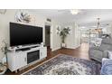 Living room with hardwood floors, fireplace, and open floor plan at 4715 Bay Ne St # 223, St Petersburg, FL 33703