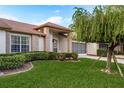 Charming single-story home featuring a well-manicured lawn and attractive landscaping at 5935 Precious View Ct, New Port Richey, FL 34655