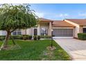 Charming single-story home featuring a well-manicured lawn and attractive landscaping at 5935 Precious View Ct, New Port Richey, FL 34655