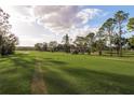 Picturesque view of a lush green golf course on a sunny day at 5935 Precious View Ct, New Port Richey, FL 34655