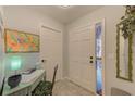 Bright and welcoming entryway with a convenient workspace and decorative mirror at 24 Windrush Bay Dr, Tarpon Springs, FL 34689