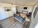 Cozy living room with hardwood floors and stylish furnishings at 4718 Blossom Dr, Holiday, FL 34690