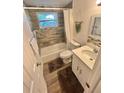 Updated bathroom with new vanity, flooring, and fixtures at 4718 Blossom Dr, Holiday, FL 34690