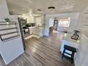 Modern kitchen with stainless steel appliances and white cabinets at 4718 Blossom Dr, Holiday, FL 34690