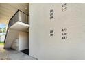 Exterior view of building with visible condo unit numbers and a staircase leading to the second floor at 716 Oakgrove Dr # 240, Brandon, FL 33510