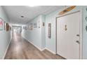 Bright hallway with beach-themed decor at 7400 Sun Island S Dr # 203, South Pasadena, FL 33707