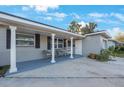 Updated home with covered porch and inviting entryway at 8254 40Th N Ave, St Petersburg, FL 33709