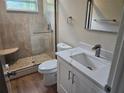Modern bathroom with a walk-in shower and quartz vanity at 2359 Finlandia Ln # 27, Clearwater, FL 33763